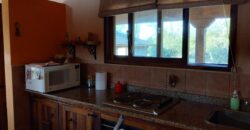Complejo de apart y chalet con amplia pileta,  gran parque y vistas