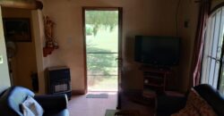 Amplio terreno con 3 viviendas, 2 piletas y vistas únicas en Las Calles